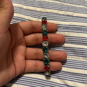 Elastic band has red green and clear FAKE diamonds